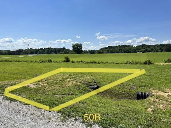 a view of a golf course with an outdoor space