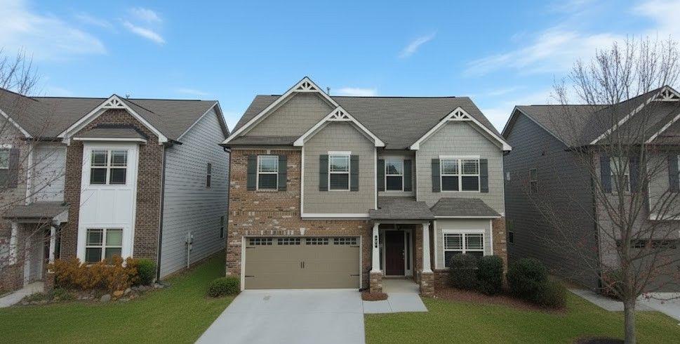 4191 Towncastle Lane Buford, GA 30518 - Photo 1 of 21 a front view of a house with a yard