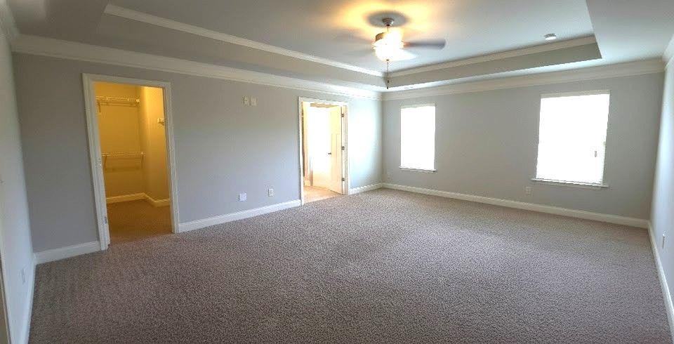 4191 Towncastle Lane Buford, GA 30518 - Photo 13 of 21 wooden floor and windows in an empty room
