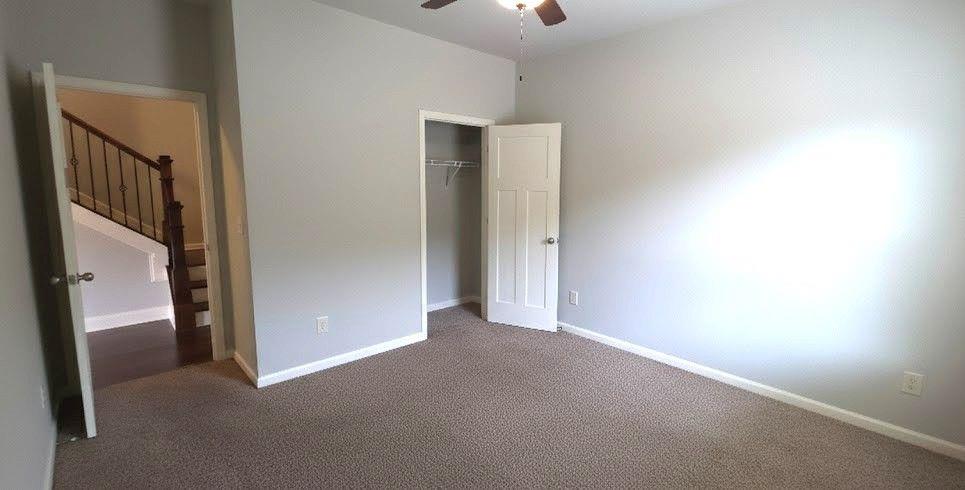 4191 Towncastle Lane Buford, GA 30518 - Photo 15 of 21 a view of an empty room with a fireplace