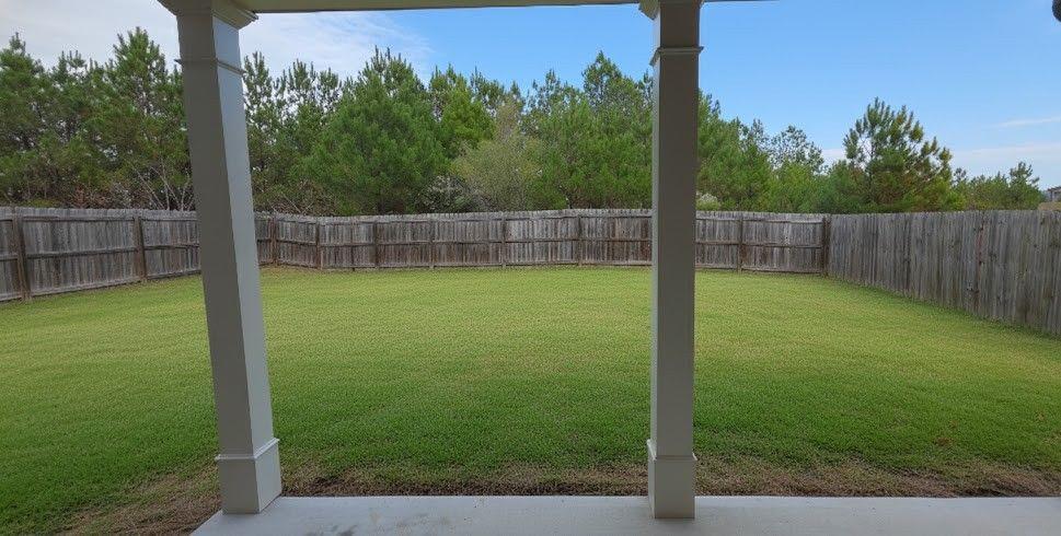 4191 Towncastle Lane Buford, GA 30518 - Photo 21 of 21 a view of a backyard with a small cabin