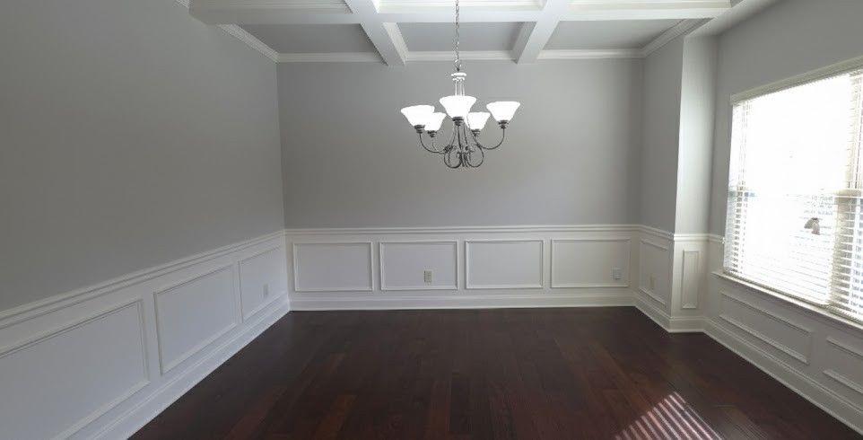 4191 Towncastle Lane Buford, GA 30518 - Photo 4 of 21 wooden floor in an empty room with a window
