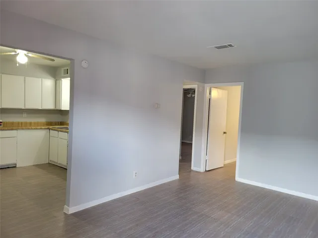 a view of a kitchen with a sink and a stove top oven