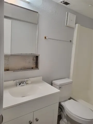 a bathroom with a sink and a toilet