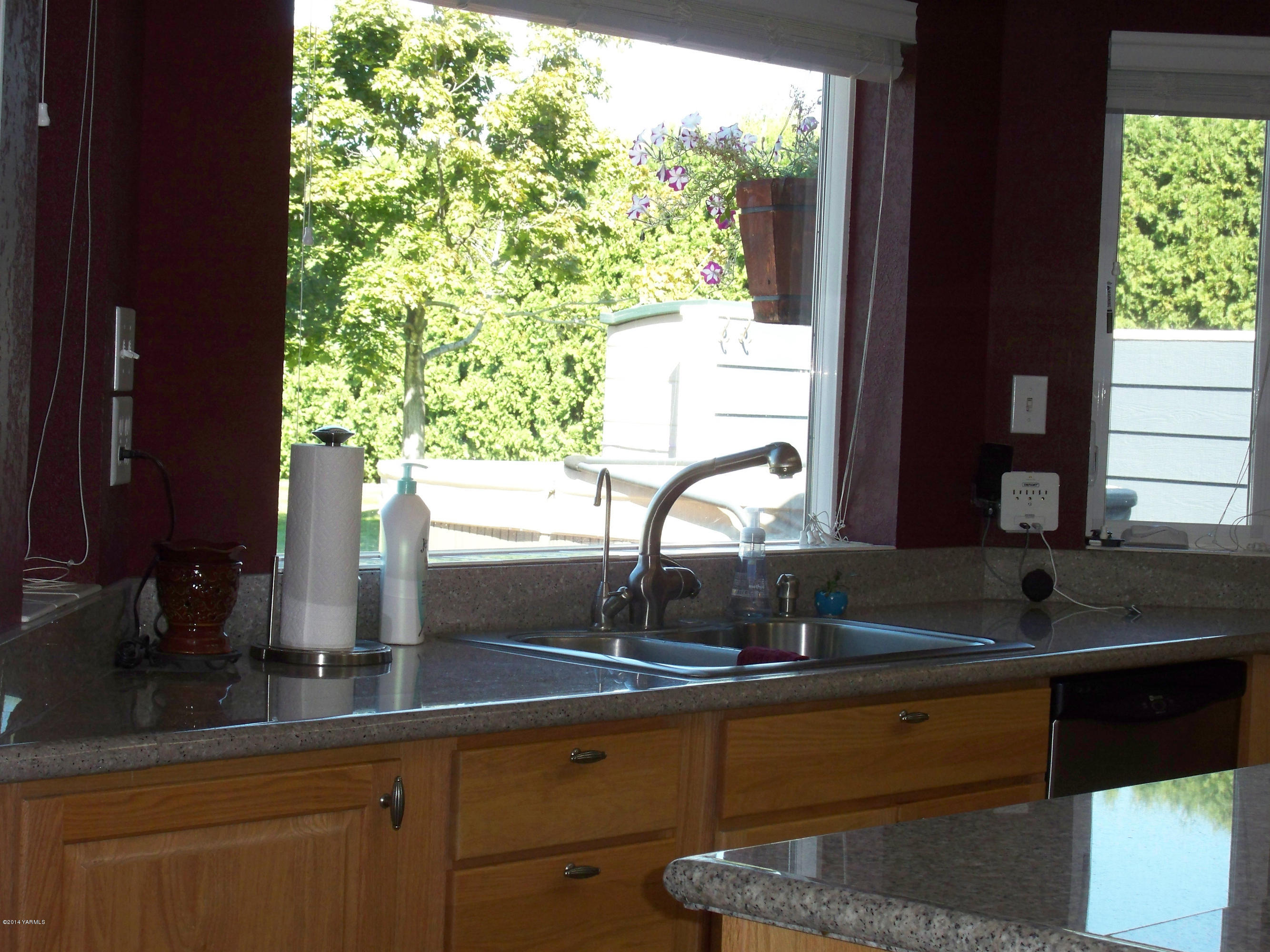 516 Bittner Road Yakima, WA 98901 - Photo 22 of 50 a sink with a granite countertop window and sink