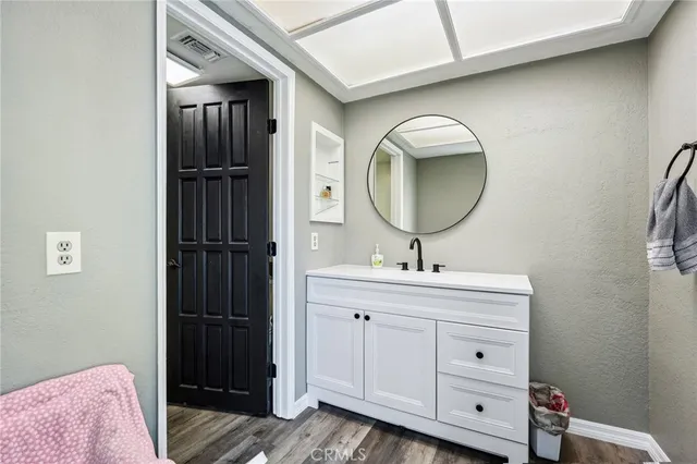 a bathroom with a sink and a mirror