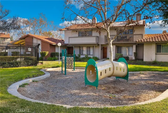 a view of a house with a yard porch and sitting area