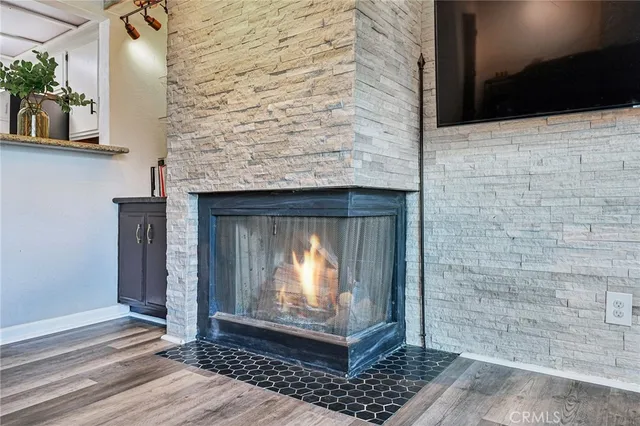 a view of fireplace with wooden floor