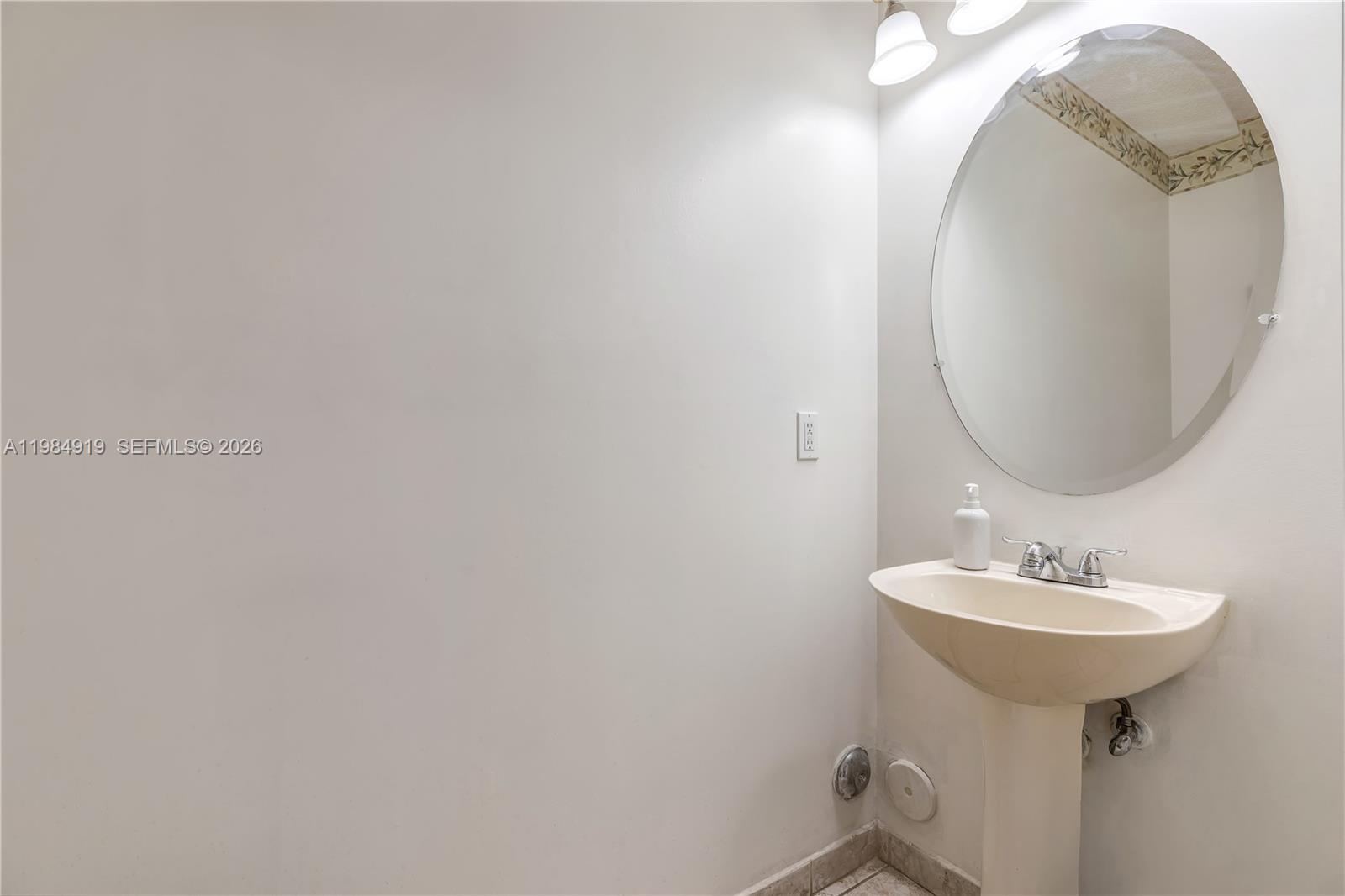 16323 Southwest 97th Street Miami, FL 33196 - Photo 12 of 44 a bathroom with a sink and a mirror