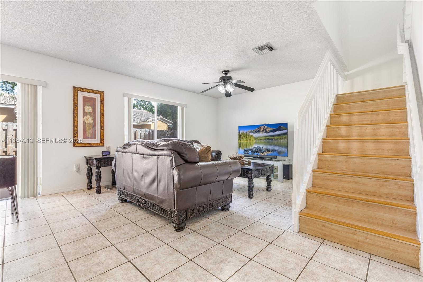 16323 Southwest 97th Street Miami, FL 33196 - Photo 15 of 44 a living room with furniture and wooden floor