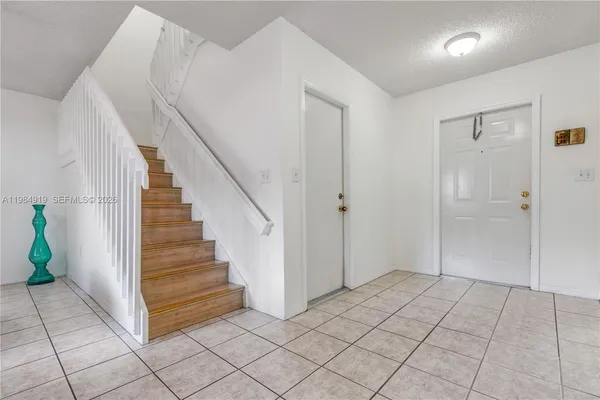 a view of an entryway with stairs