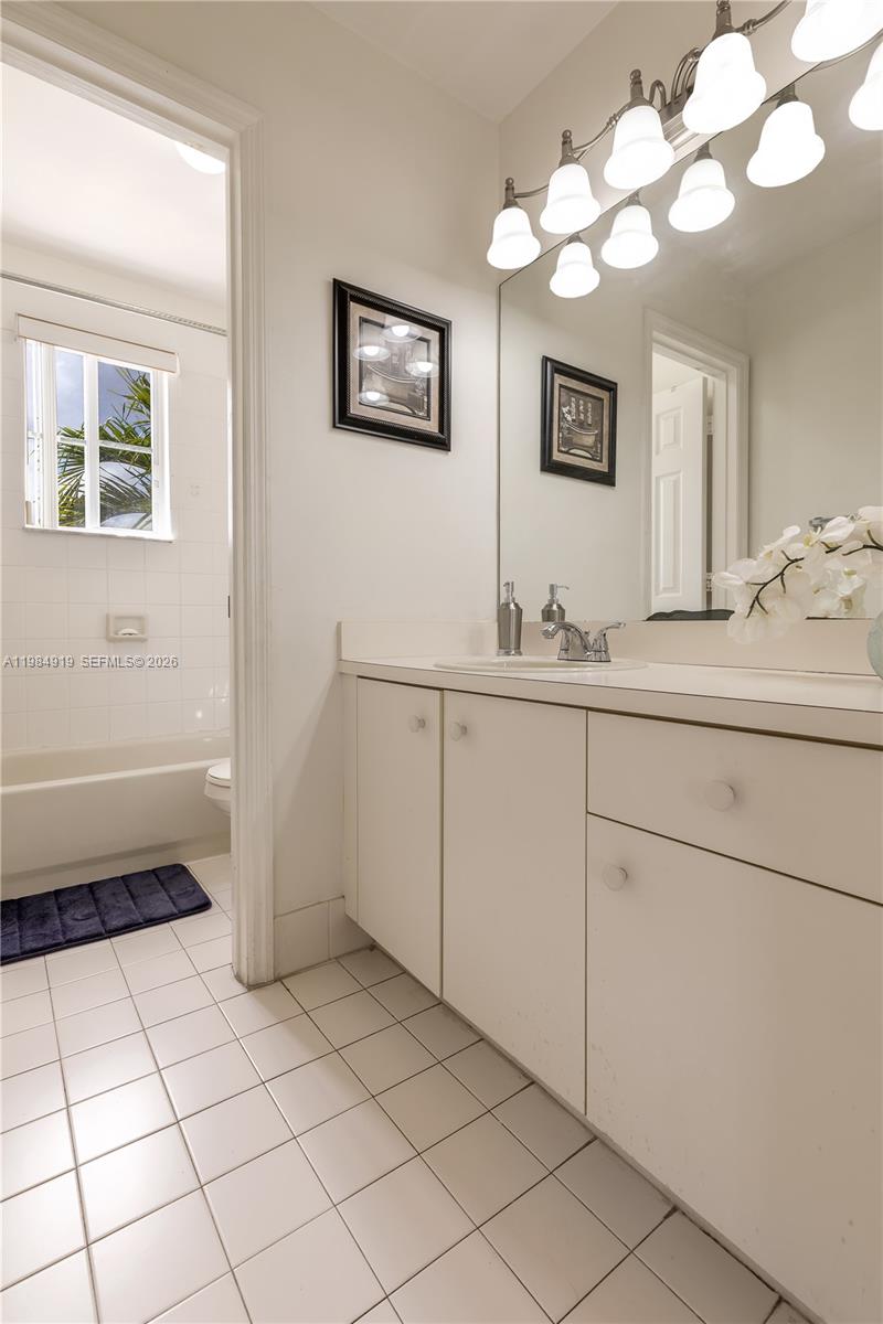 16323 Southwest 97th Street Miami, FL 33196 - Photo 27 of 44 a kitchen with a sink and cabinets