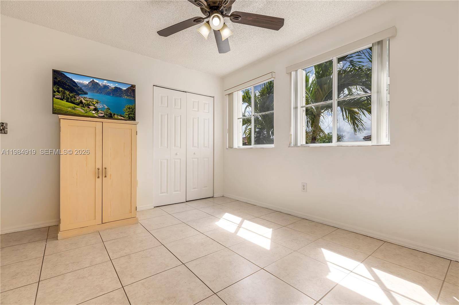 16323 Southwest 97th Street Miami, FL 33196 - Photo 28 of 44 a view of an empty room with a window