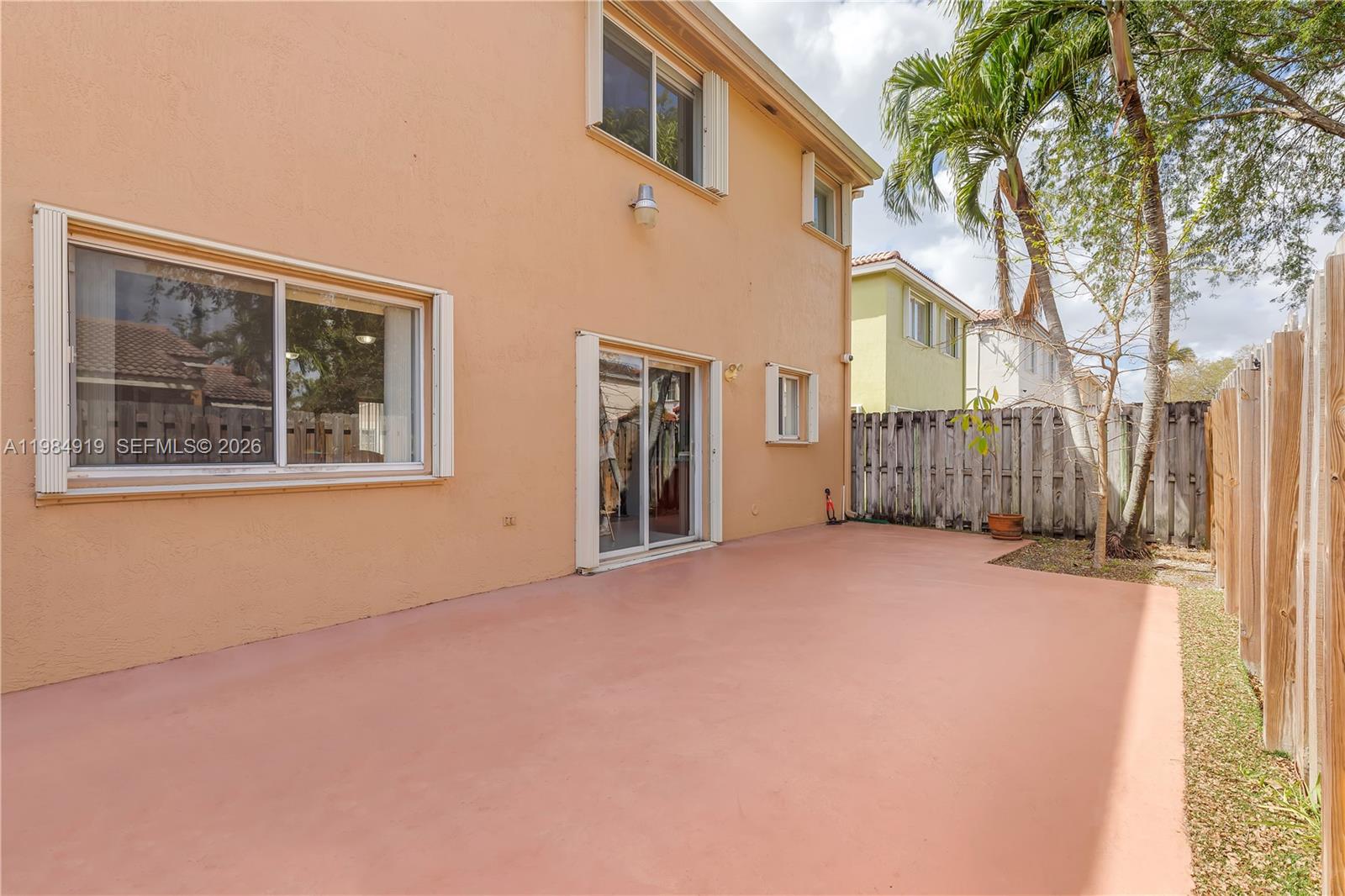 16323 Southwest 97th Street Miami, FL 33196 - Photo 35 of 44 a view of an house with backyard and trees