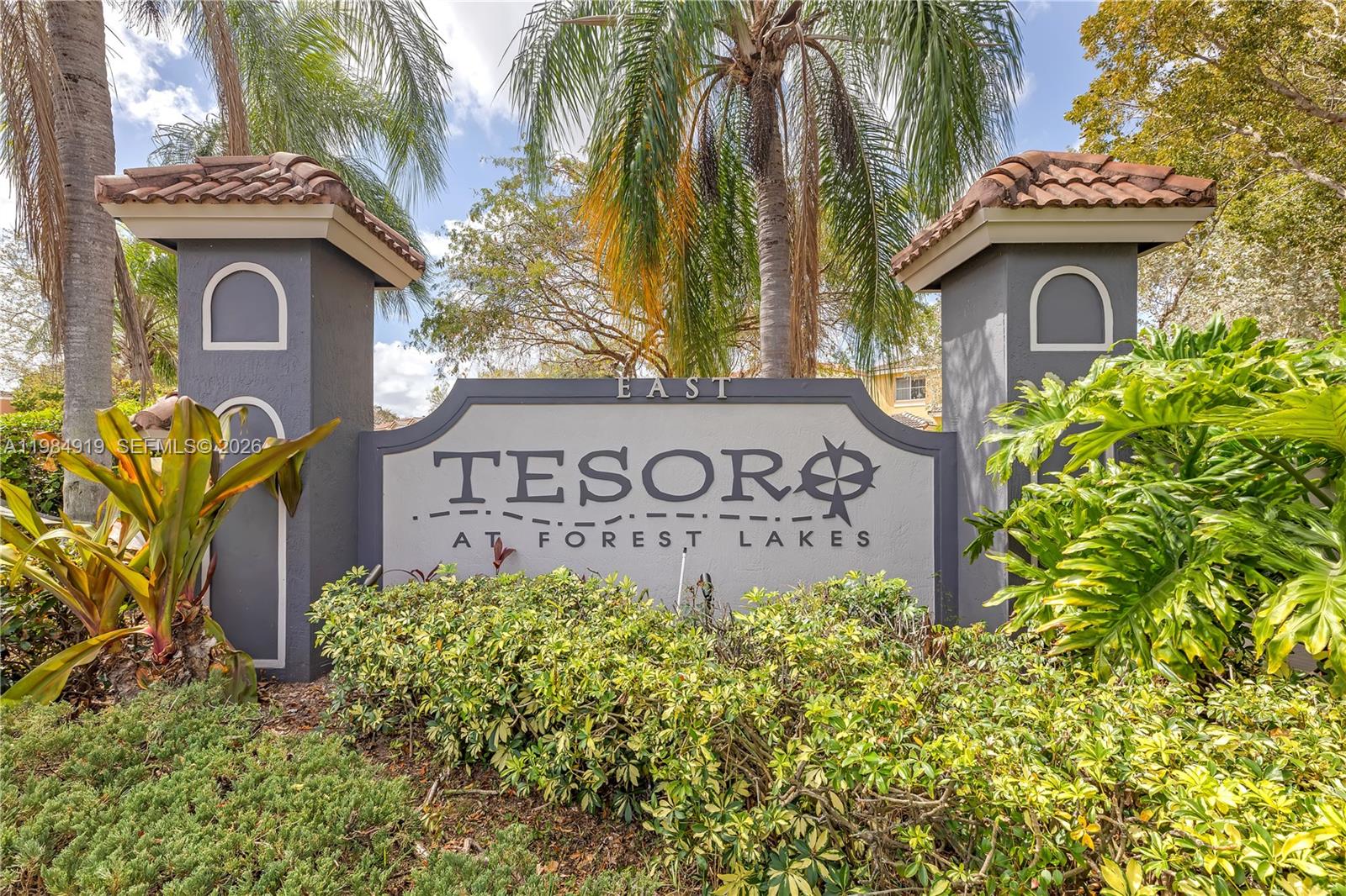 16323 Southwest 97th Street Miami, FL 33196 - Photo 40 of 44 a view of a sign board with a small yard