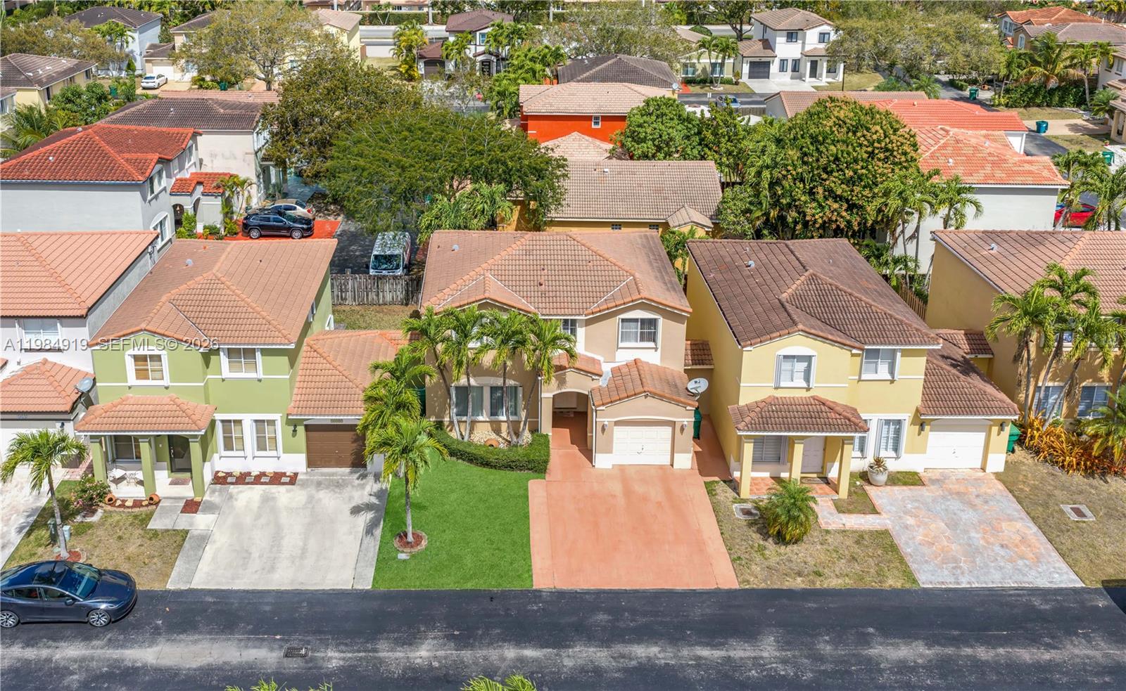 16323 Southwest 97th Street Miami, FL 33196 - Photo 41 of 44 an aerial view of multiple houses with yard