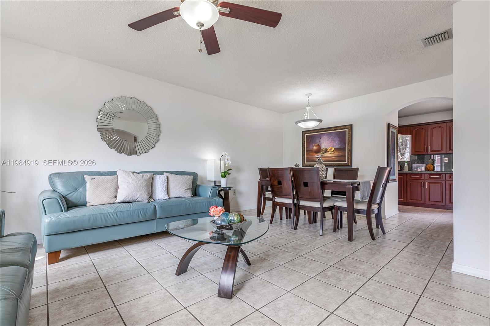 16323 Southwest 97th Street Miami, FL 33196 - Photo 5 of 44 a living room with furniture and kitchen view
