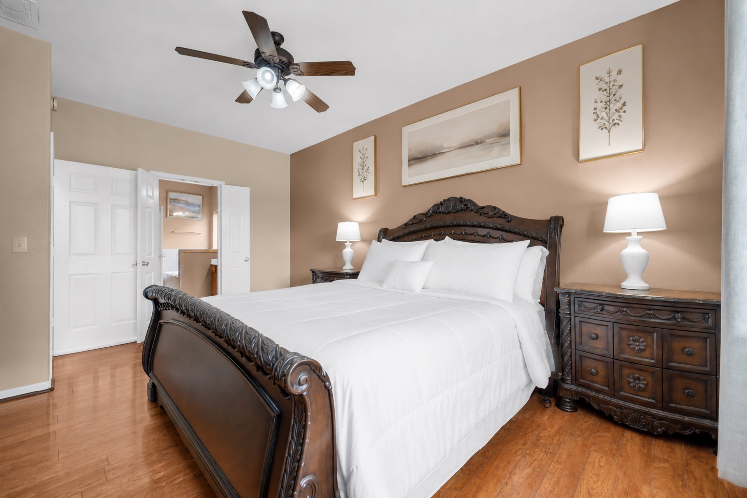 5406 Quarry Ridge Road Richmond, TX 77407 - Photo 20 of 36 Spacious primary bedroom filled with natural light, featuring a comfortable layout and French doors that provide a seamless transition to the private primary bath.