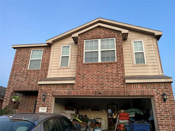 a front view of a house with many windows