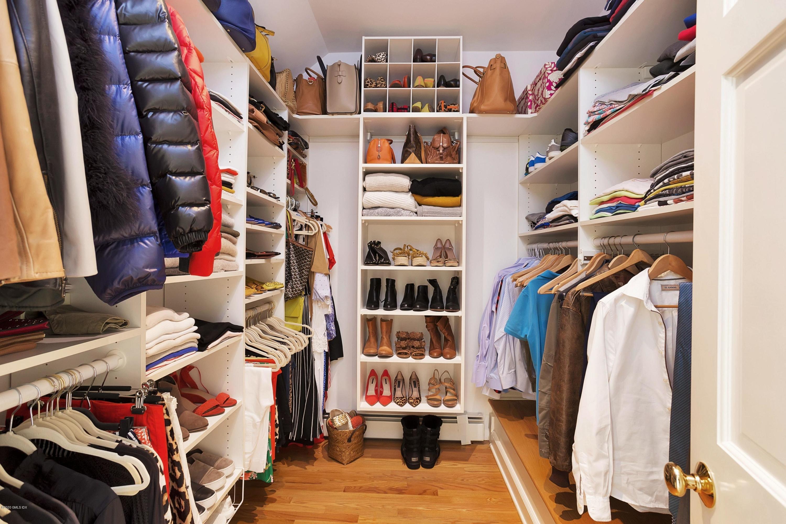 111 Lockwood Road Riverside, CT 06878 - Photo 17 of 35 a view of walk in closet with clothes and shoes