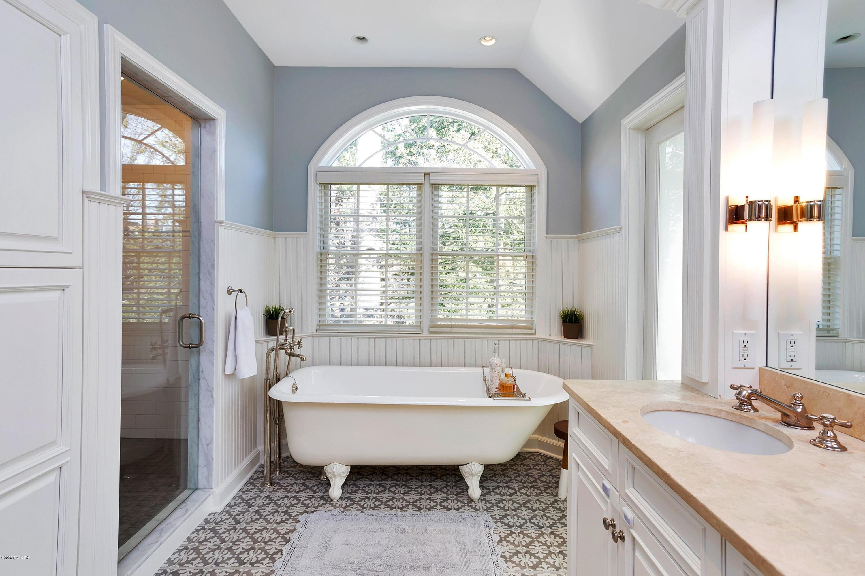 111 Lockwood Road Riverside, CT 06878 - Photo 19 of 35 a spacious bathroom with a bathtub and a shower