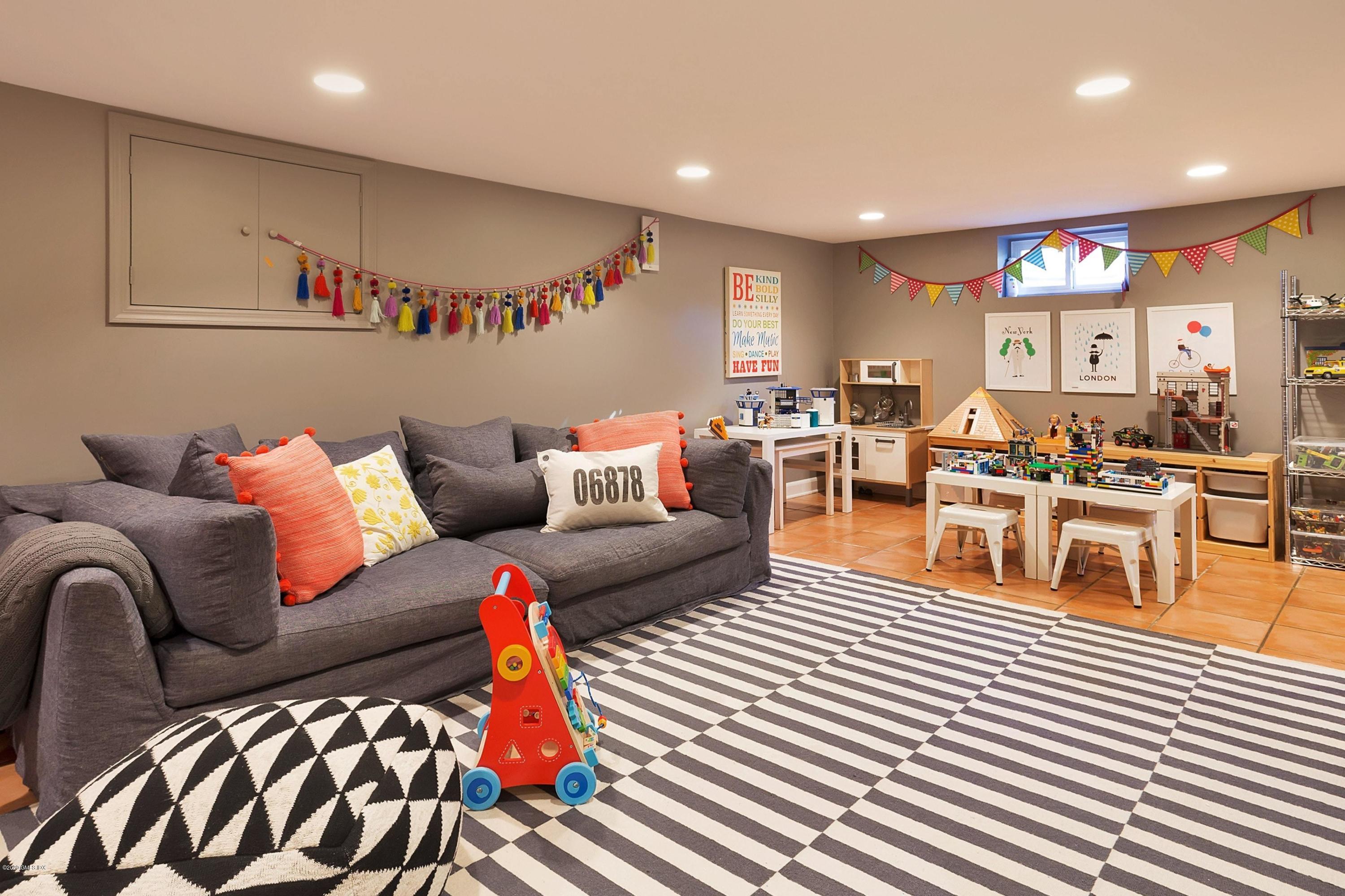 111 Lockwood Road Riverside, CT 06878 - Photo 26 of 35 a living room with furniture a rug and white walls