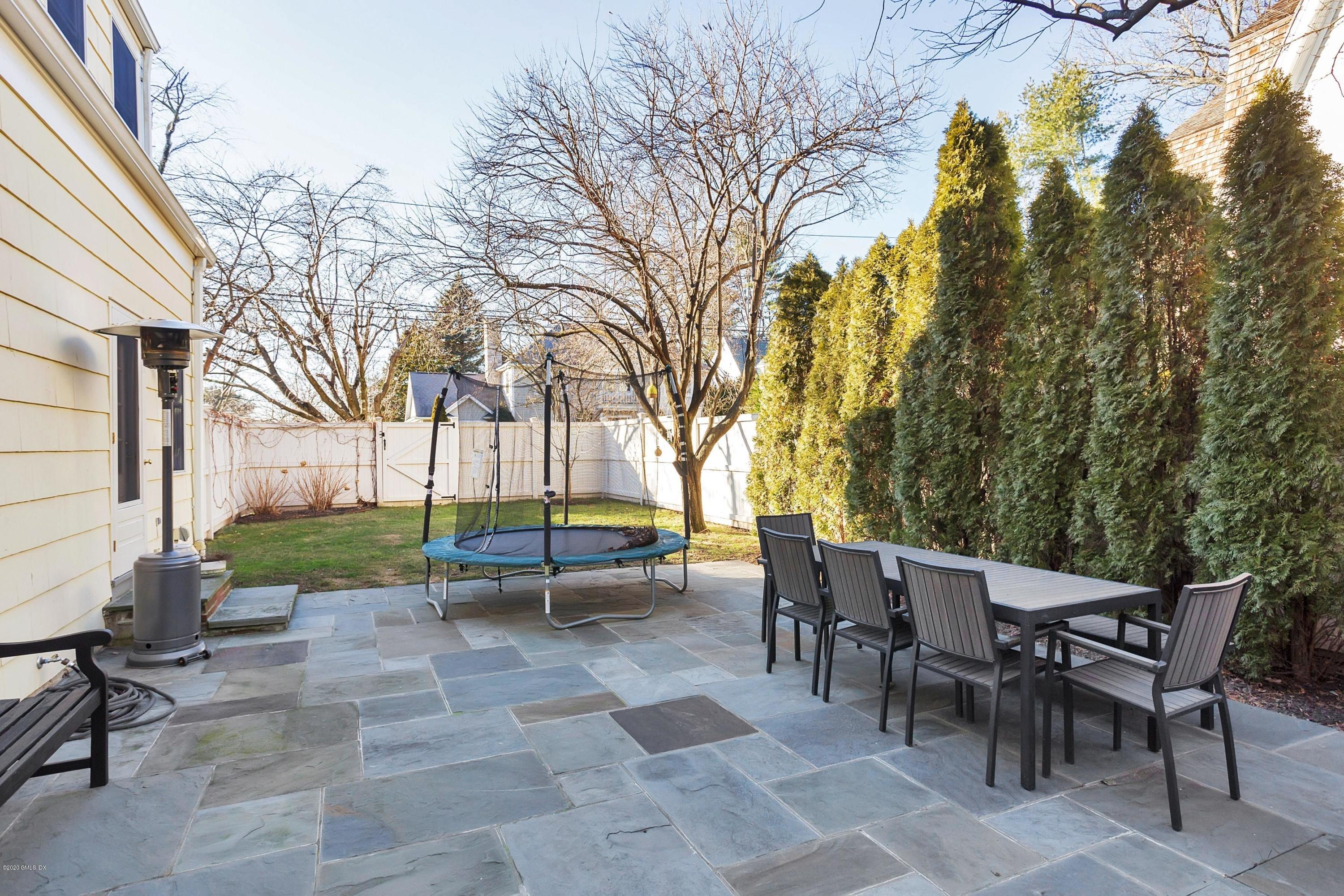 111 Lockwood Road Riverside, CT 06878 - Photo 30 of 35 a view of a patio with table and chairs and couches