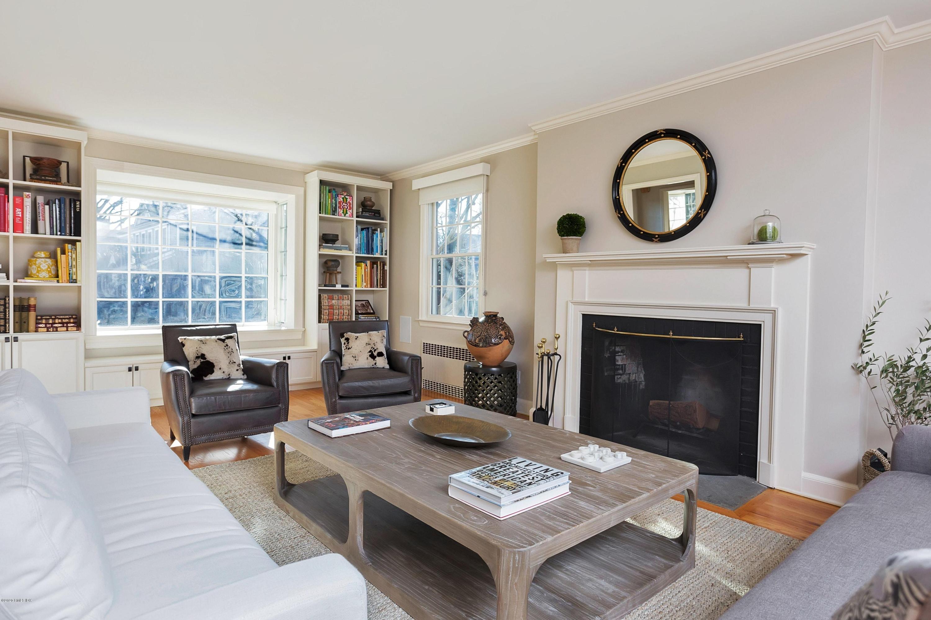 111 Lockwood Road Riverside, CT 06878 - Photo 6 of 35 a living room with furniture a rug a fireplace and a large window