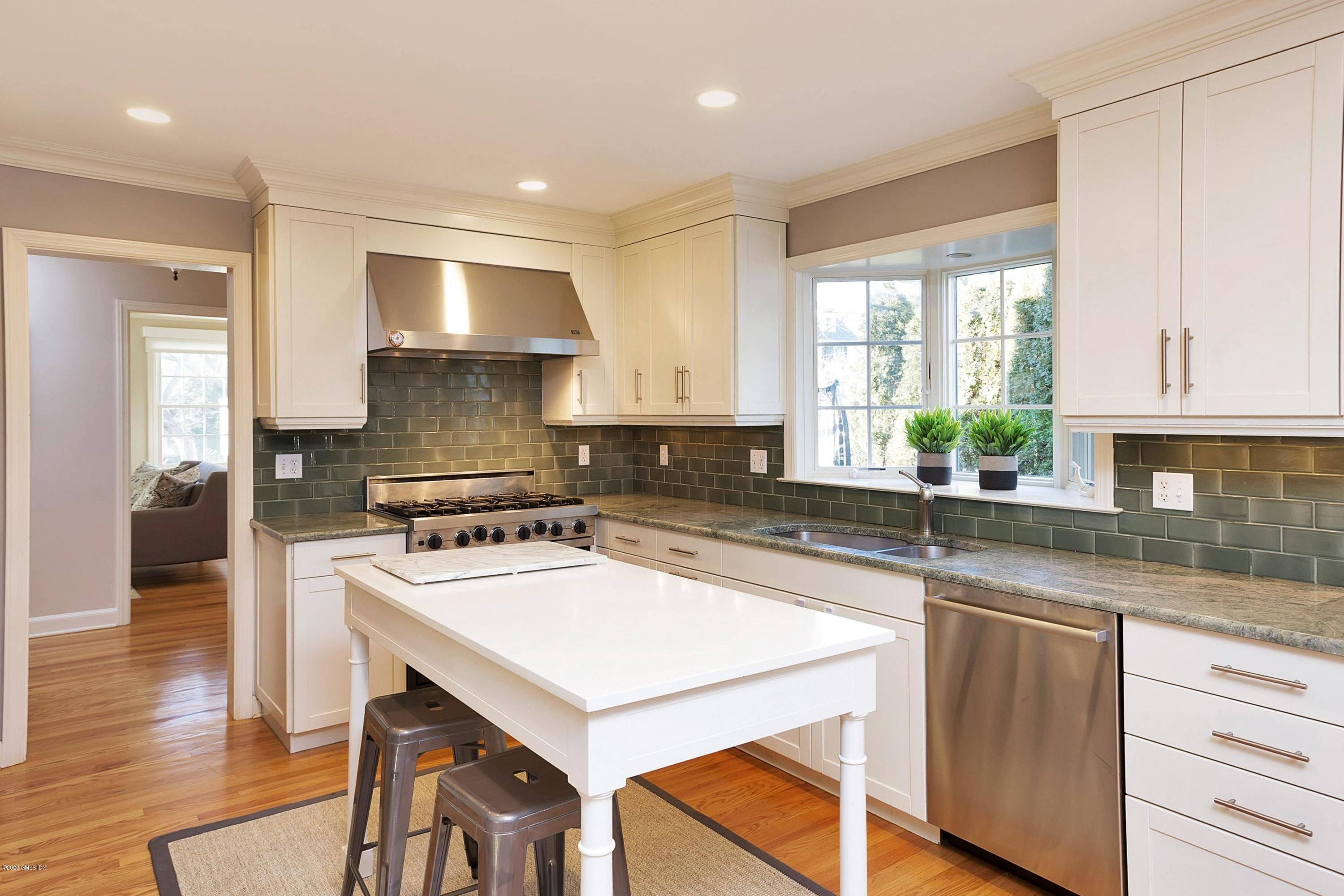 111 Lockwood Road Riverside, CT 06878 - Photo 9 of 35 a kitchen with a stove a sink and a refrigerator