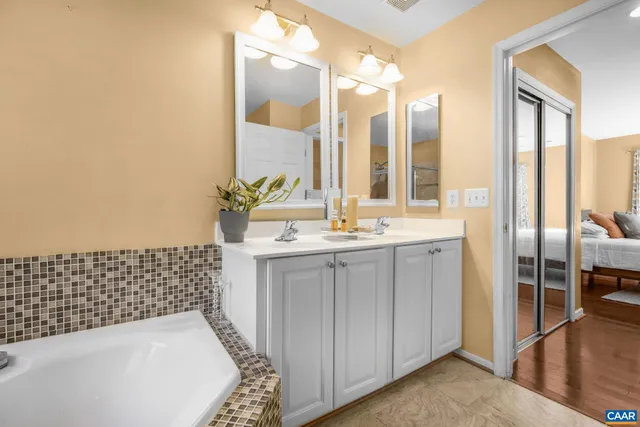 a bathroom with a bathtub and a sink