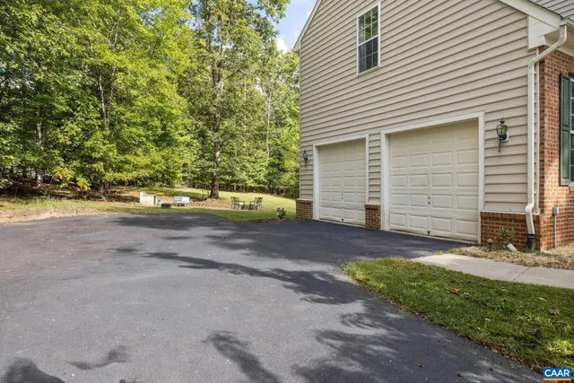a view of a backyard with plants and trees