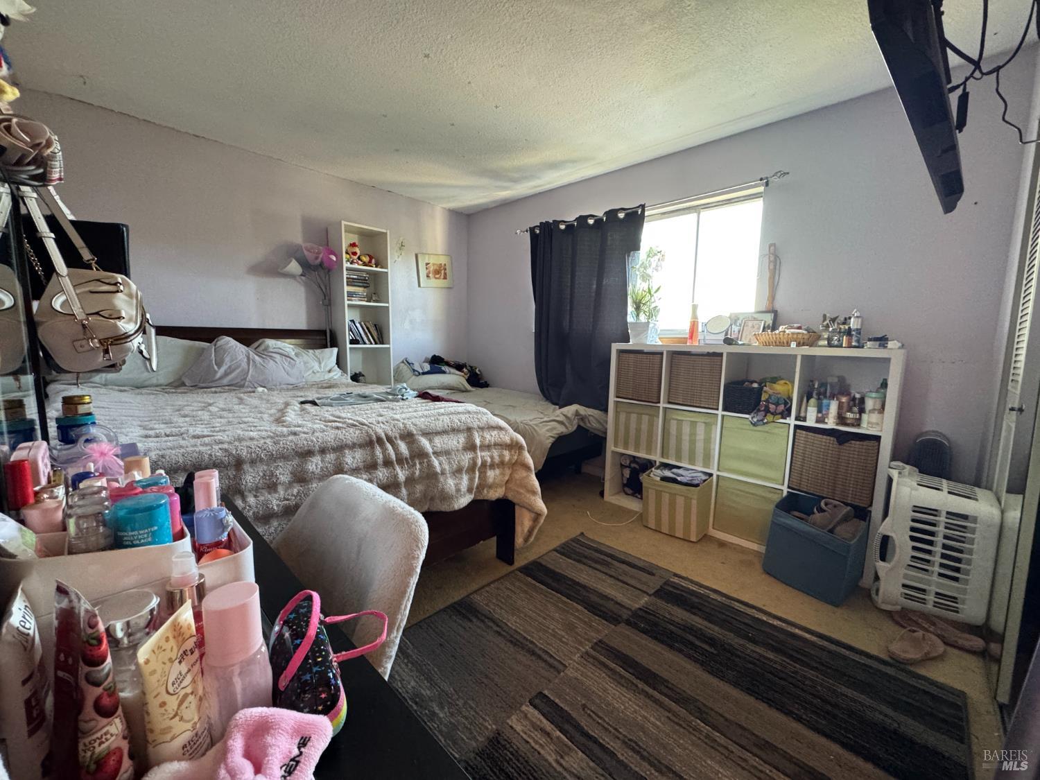 431 Bahia Way San Rafael, CA 94901 - Photo 6 of 46 a bed room with a bed and a chair
