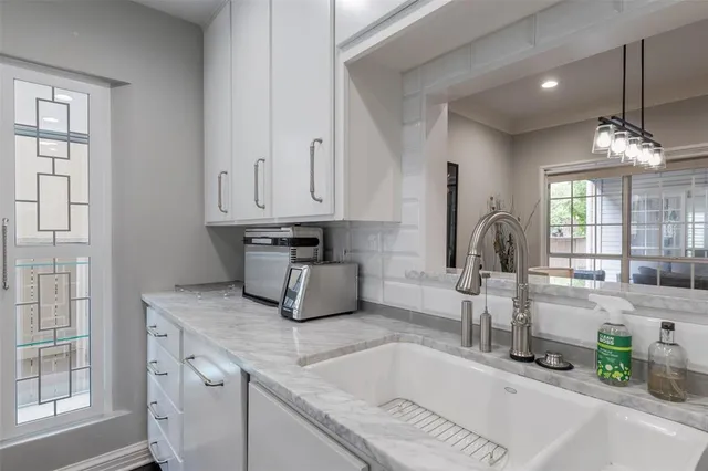 a kitchen with sink and window