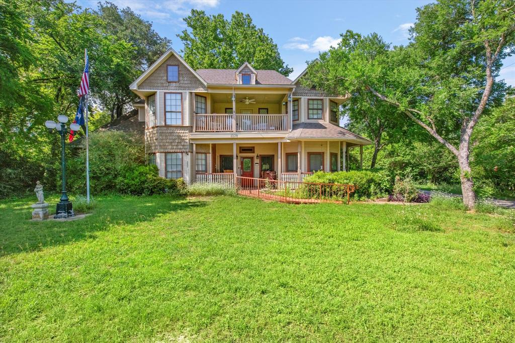 1578 Stainback Road Red Oak, TX 75154 - Photo 1 of 37 a front view of a house with a yard table and chairs