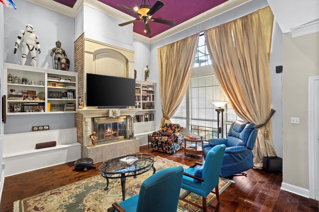 1578 Stainback Road Red Oak, TX 75154 - Photo 5 of 37 a living room with furniture a flat screen tv and a floor to ceiling window
