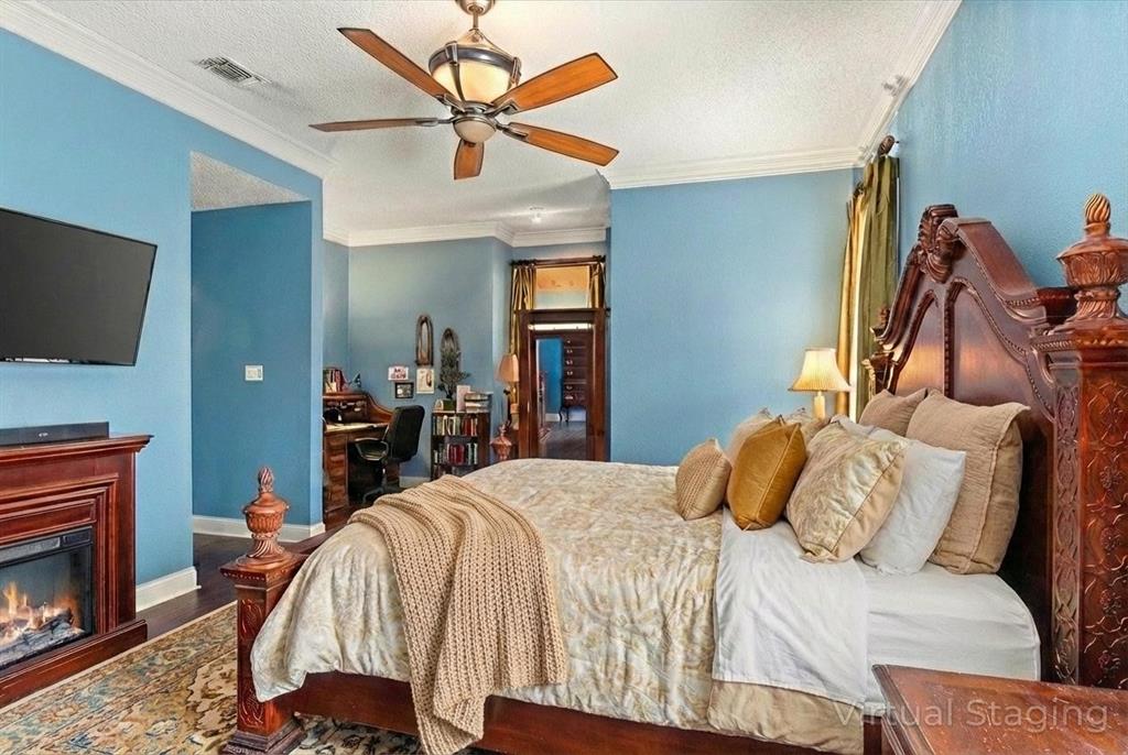 1578 Stainback Road Red Oak, TX 75154 - Photo 8 of 37 a bedroom with a bed and a flat screen tv