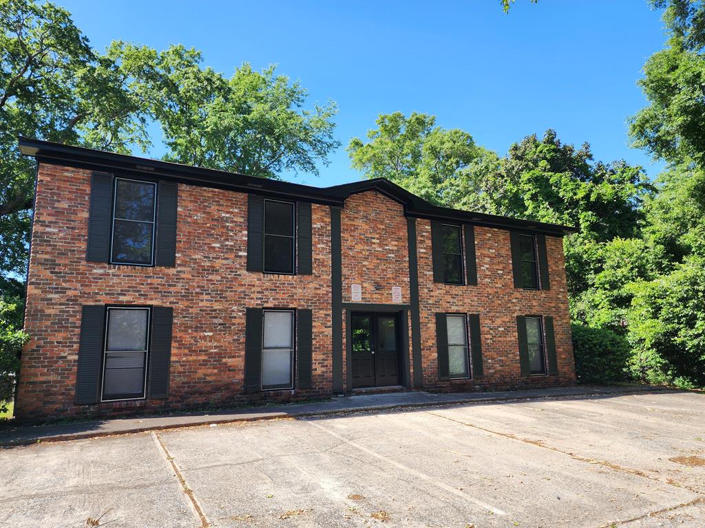 3658 Maryland Circle, Unit C Columbus, GA 31907 - Photo 1 of 8 a front view of a house with a garden
