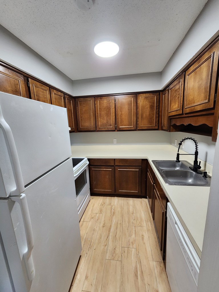 3658 Maryland Circle, Unit C Columbus, GA 31907 - Photo 6 of 8 a kitchen with a sink a window and cabinets