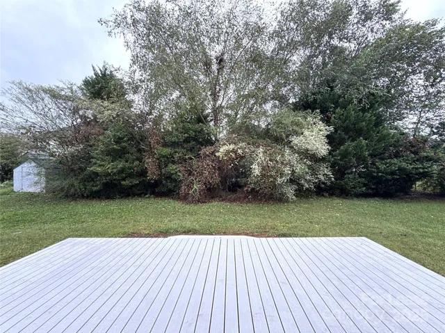 a view of a backyard with wooden floor