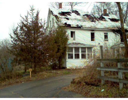 46 Spring Street Warren, MA 01092 - Photo 1 of 1 a view of a white house next to a yard
