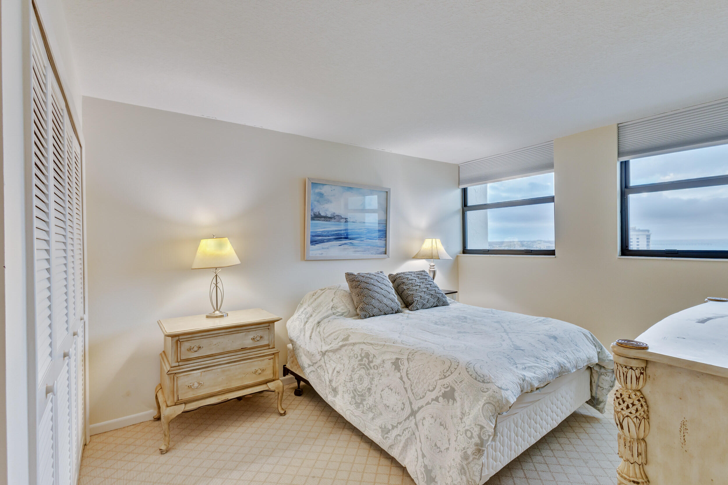 600 Ocean Drive, Unit 11A Juno Beach, FL 33408 - Photo 34 of 51 a bedroom with a bed and a couch