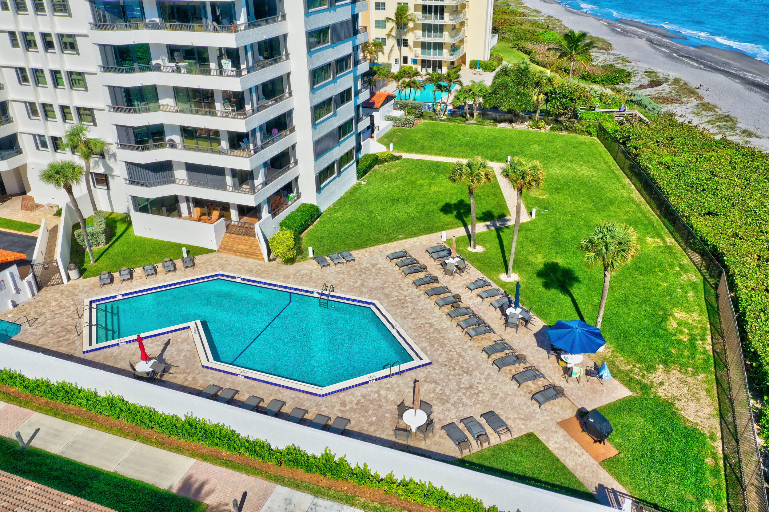 600 Ocean Drive, Unit 11A Juno Beach, FL 33408 - Photo 50 of 51 a view of a backyard with plants and outdoor seating