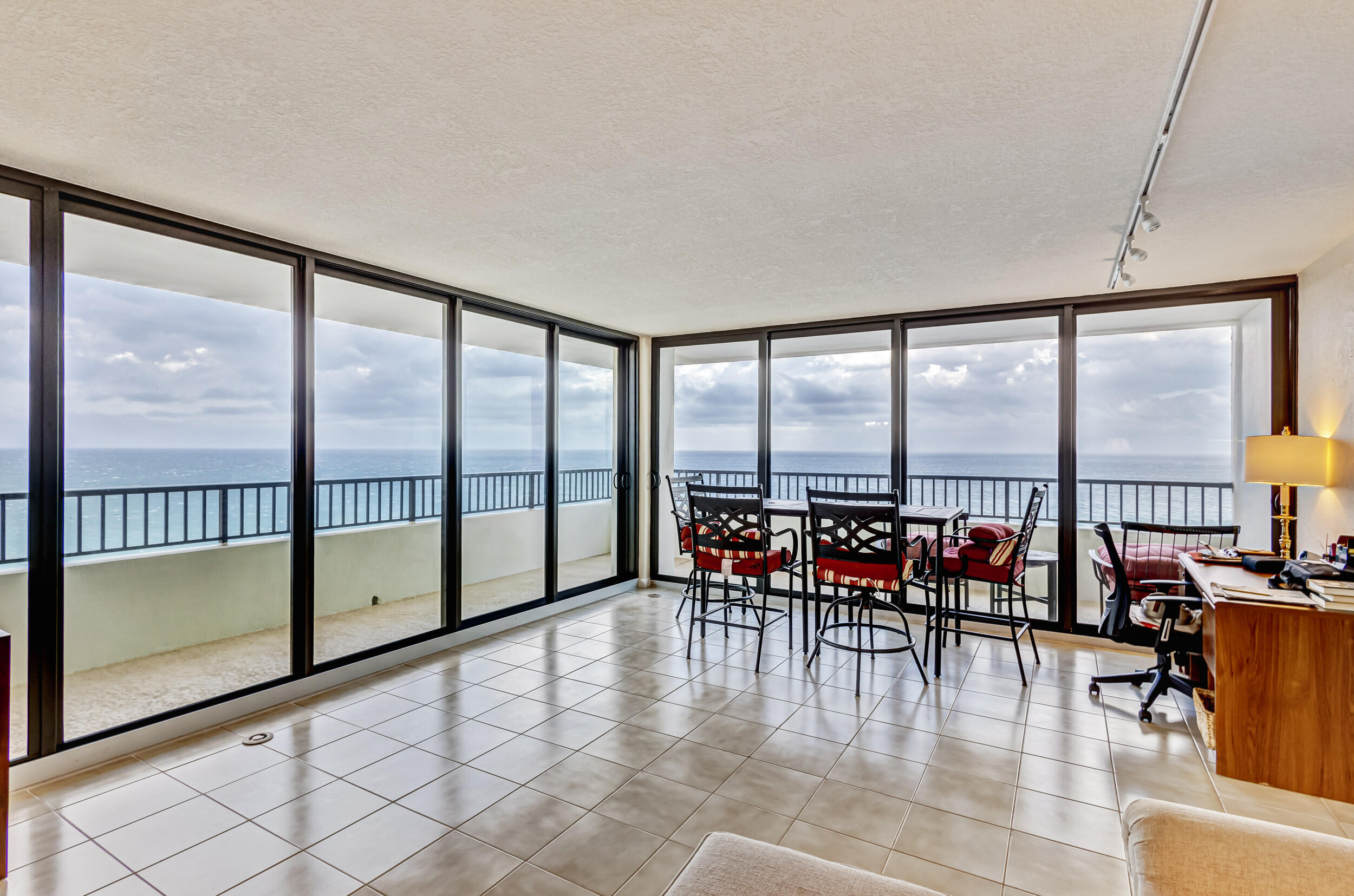 600 Ocean Drive, Unit 11A Juno Beach, FL 33408 - Photo 7 of 51 a dining room with furniture and floor to ceiling window