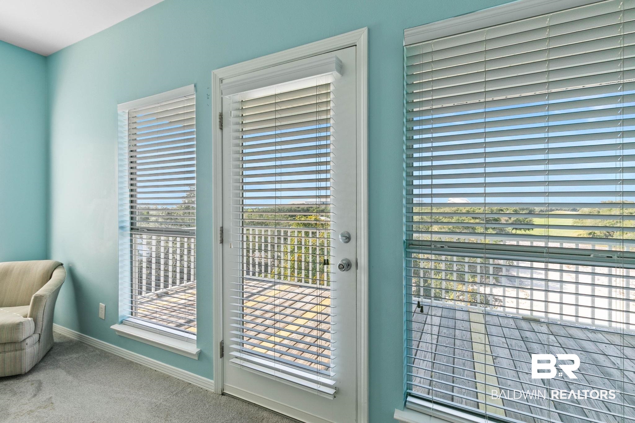 545 Plantation Road, Unit 3 Gulf Shores, AL 36542 - Photo 32 of 54 Doorway to outside with carpet floors and baseboards
