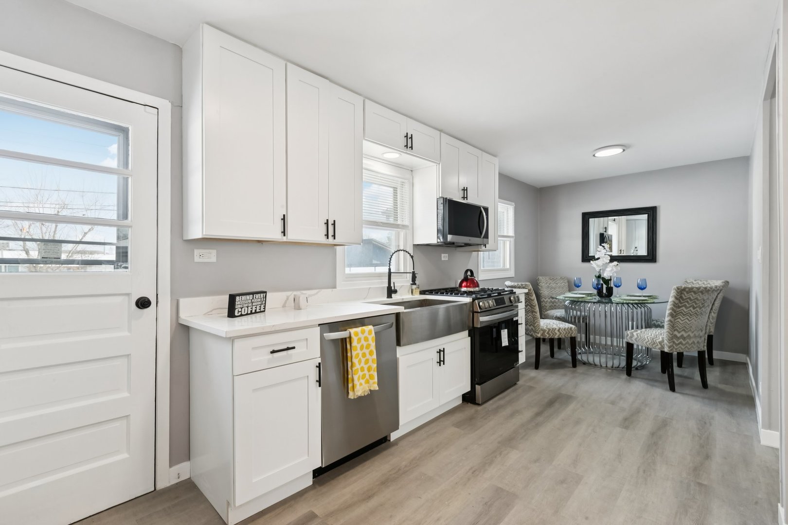 4N327 7th Avenue Addison, IL 60101 - Photo 12 of 49 a kitchen with cabinets a sink and appliances in it