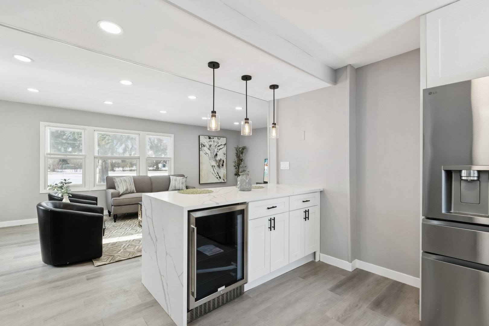 4N327 7th Avenue Addison, IL 60101 - Photo 15 of 49 a view of a kitchen with stainless steel appliances granite countertop a refrigerator a sink dishwasher a stove and a dining table with wooden floor