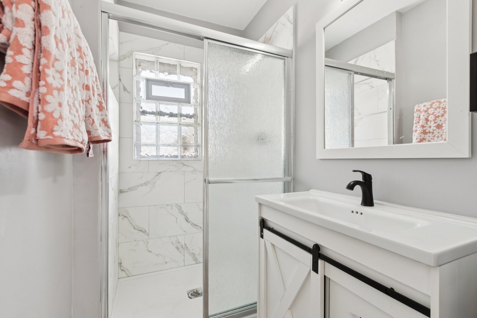 4N327 7th Avenue Addison, IL 60101 - Photo 21 of 49 a bathroom with a sink and a mirror