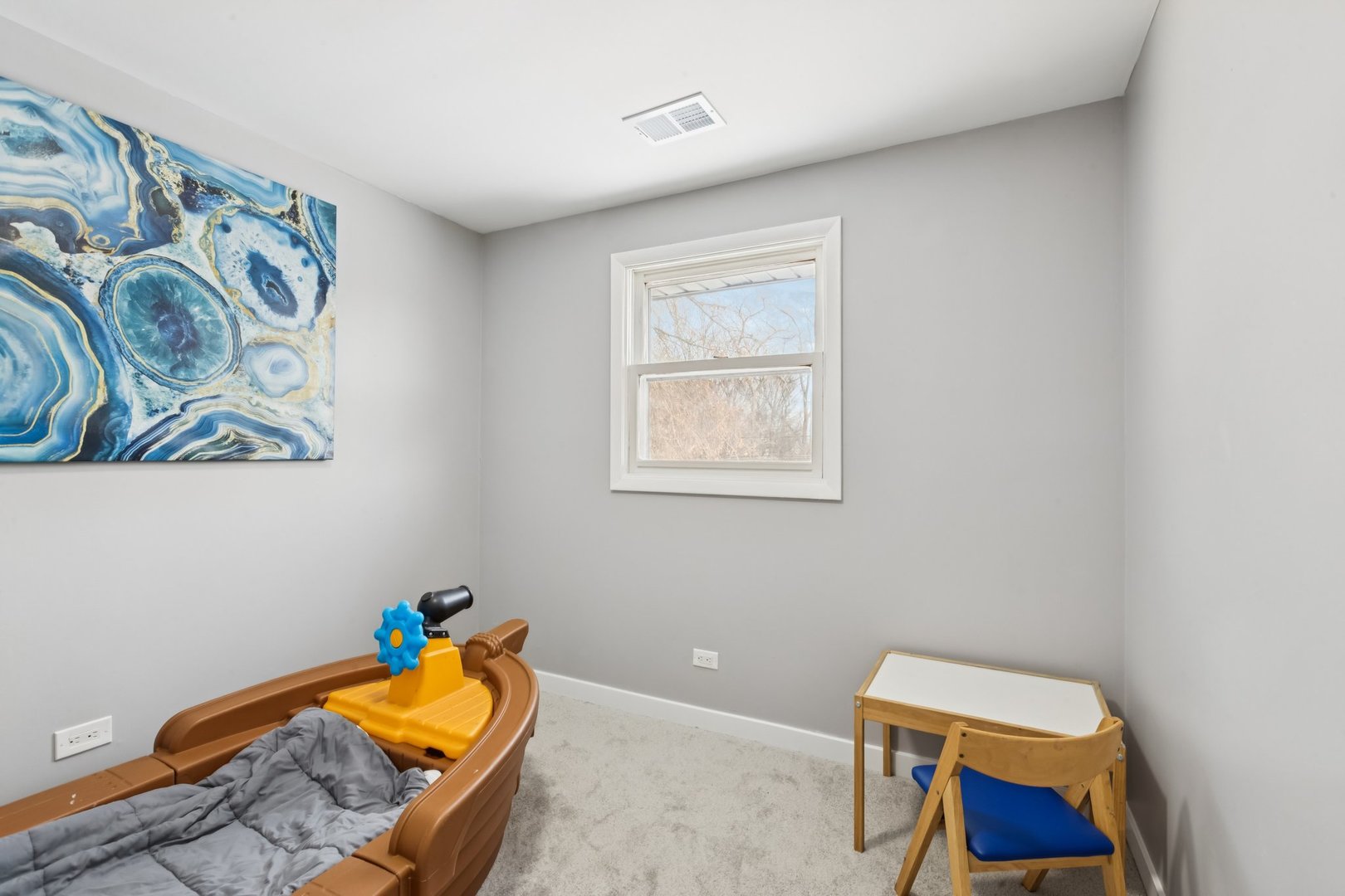 4N327 7th Avenue Addison, IL 60101 - Photo 27 of 49 a bedroom with a bed and wooden floor