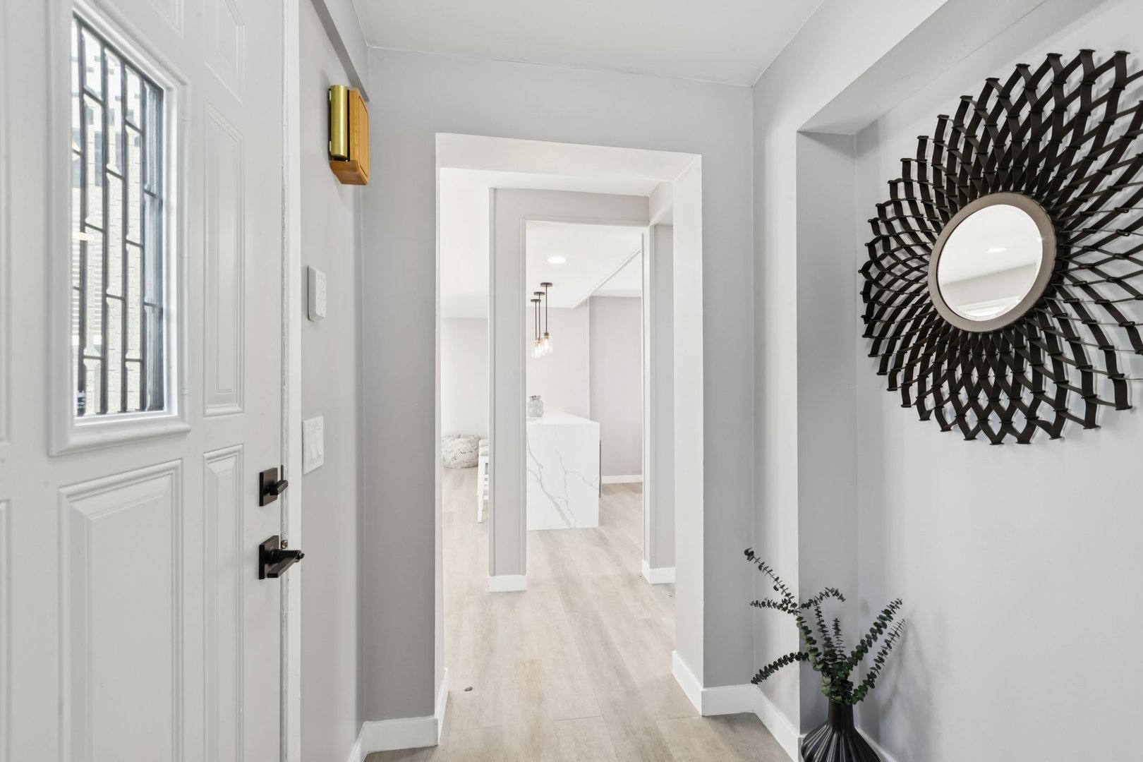 4N327 7th Avenue Addison, IL 60101 - Photo 3 of 49 a view of a hallway with wooden floor and glass door