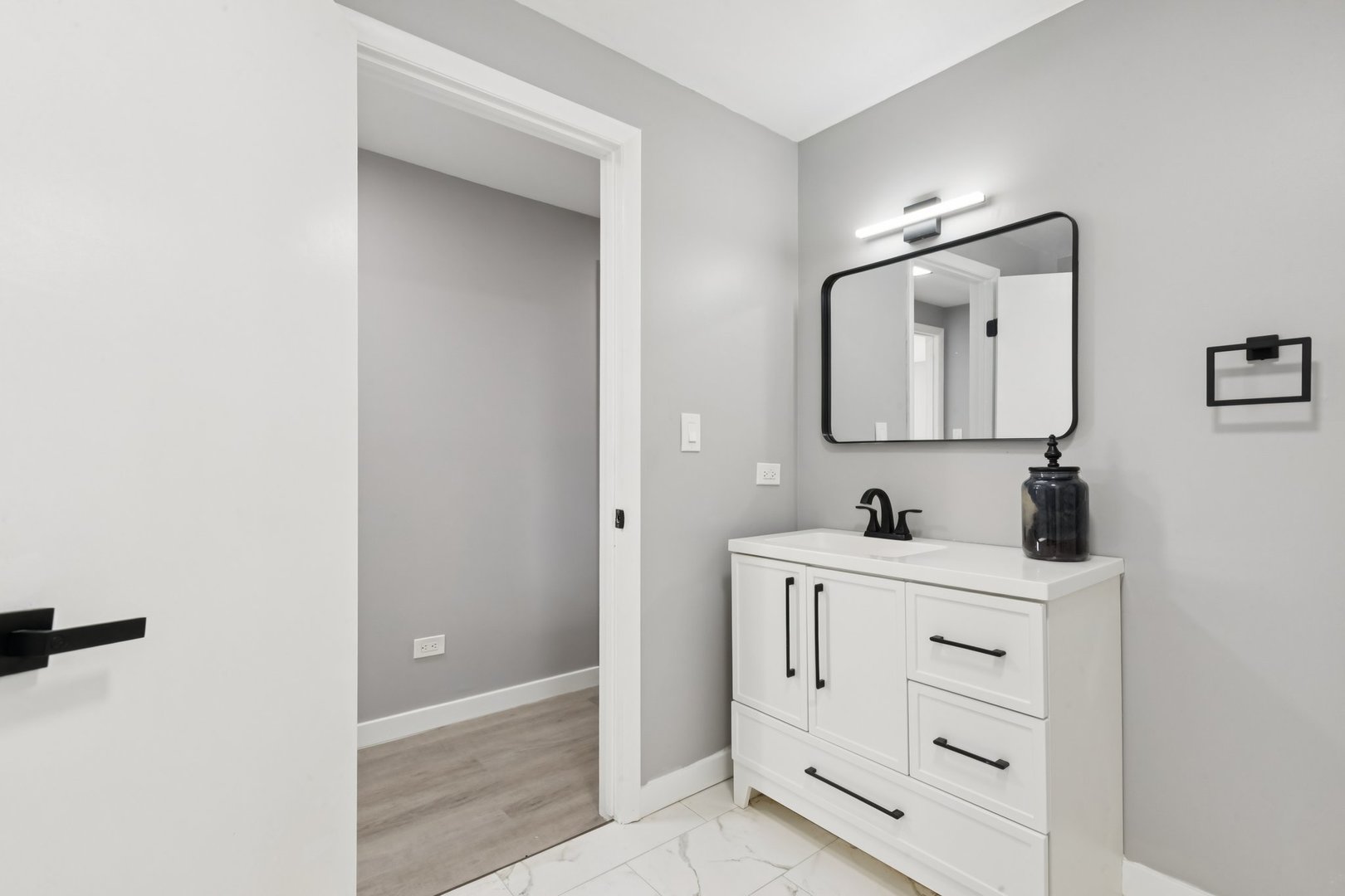 4N327 7th Avenue Addison, IL 60101 - Photo 34 of 49 a bathroom with a toilet sink and mirror